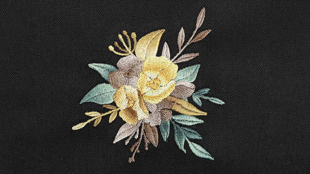 Embroidery design of a flower with yellow, green and brown shade gradients