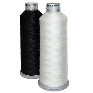 [Translate to Italienisch:] Black and white aramid bobbin thread cones