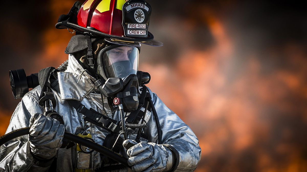 Fire fighter in protection clothing