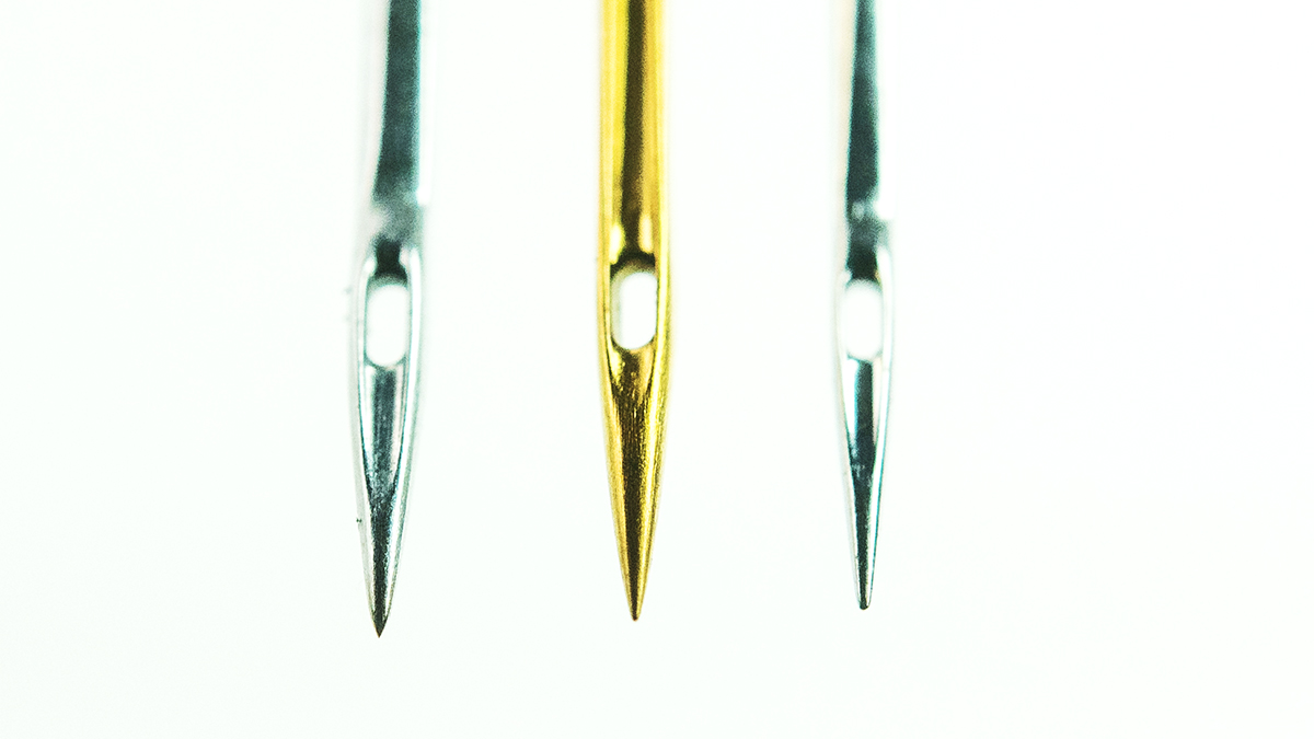 embroidery machine needles in gold & silver